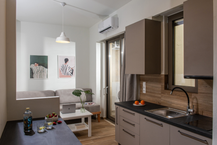 Enea City Suites Kitchen and Sofa