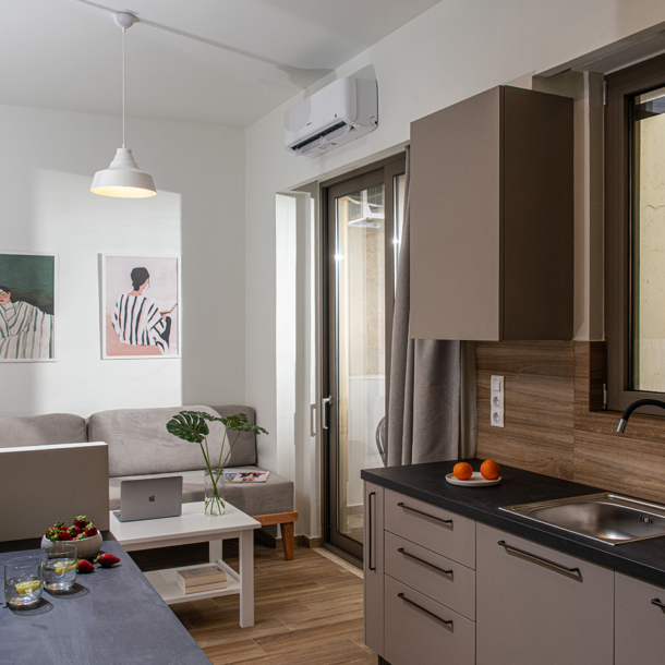 Enea City Suites Kitchen and Sofa