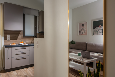 Enea City Suites Kitchen and Sofa